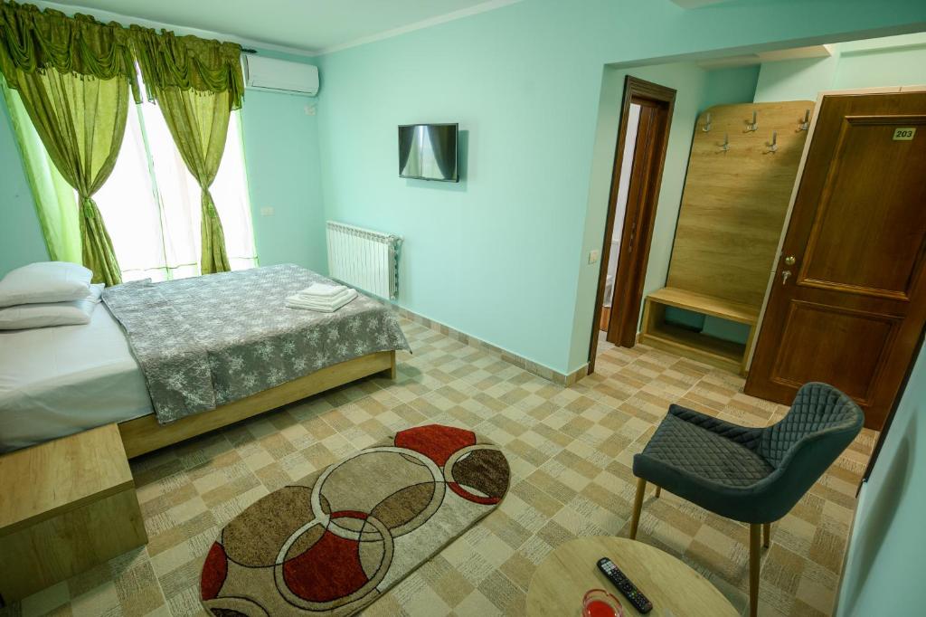 Postel nebo postele na pokoji v ubytování Hotel Austin Ov
