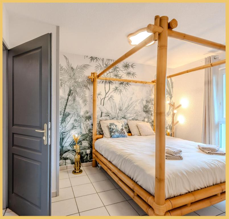 Postel nebo postele na pokoji v ubytování Le Paradis Tropical