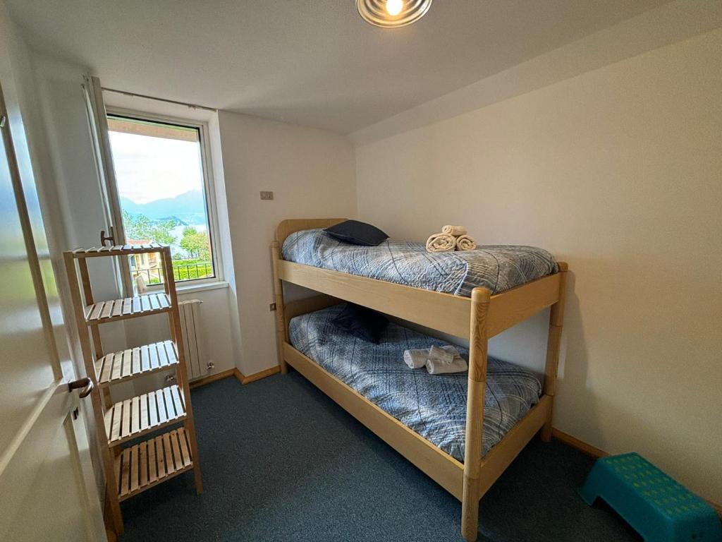 Postel nebo postele na pokoji v ubytování Lake Como Serenity Suite