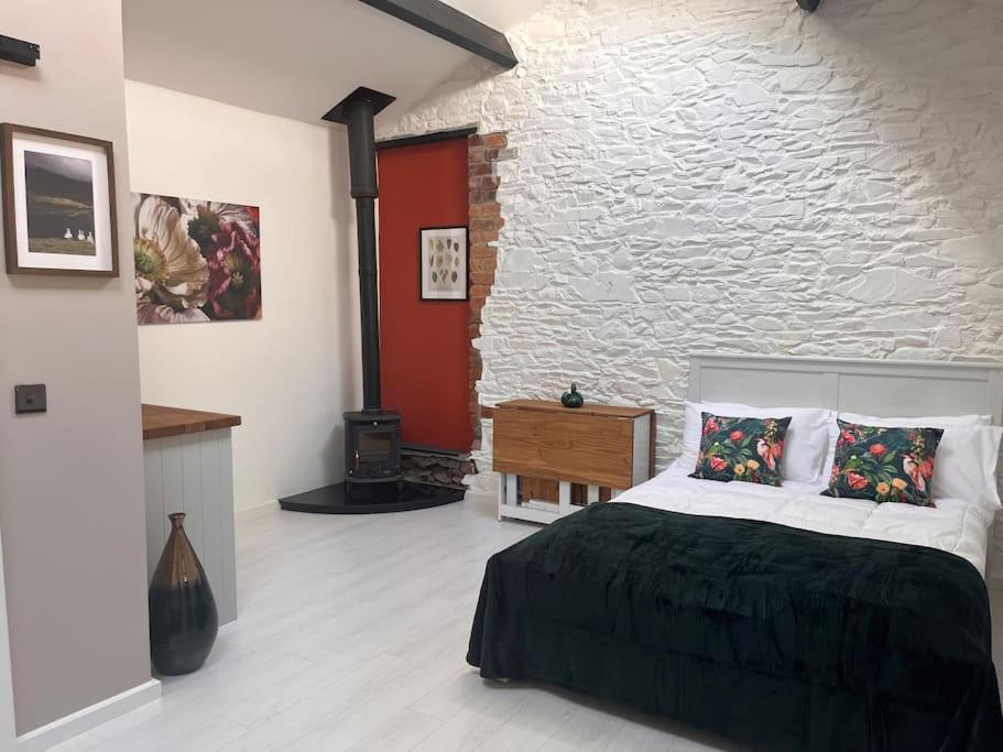 Postel nebo postele na pokoji v ubytování Linden Lodge
