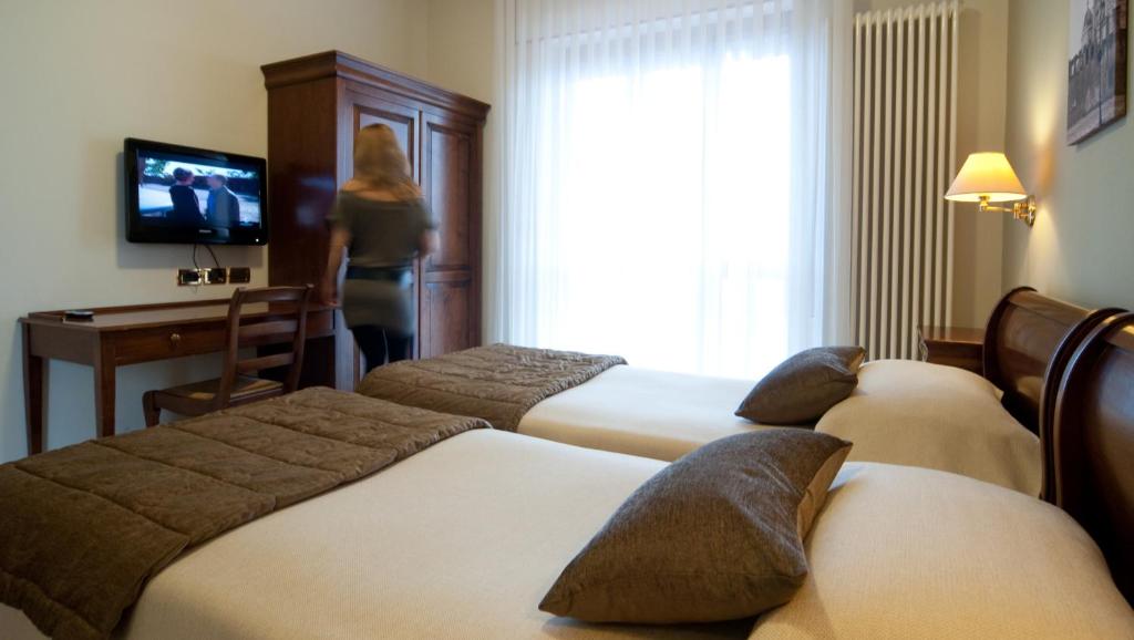Postel nebo postele na pokoji v ubytování Hotel Belvedere Thiene