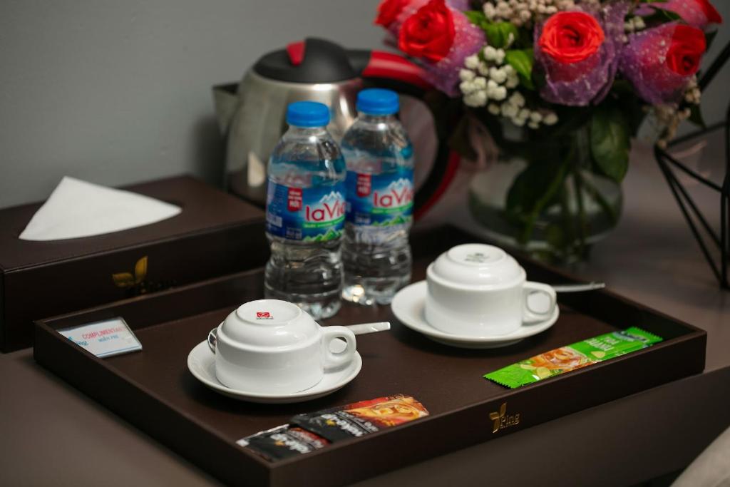 Příslušenství pro přípravu čaje a kávy v ubytování Ping Hotel