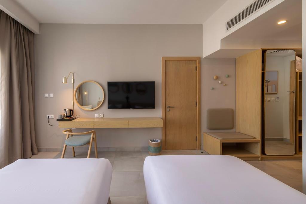 Postel nebo postele na pokoji v ubytování Marassi Boutique Hotel-Marina 1