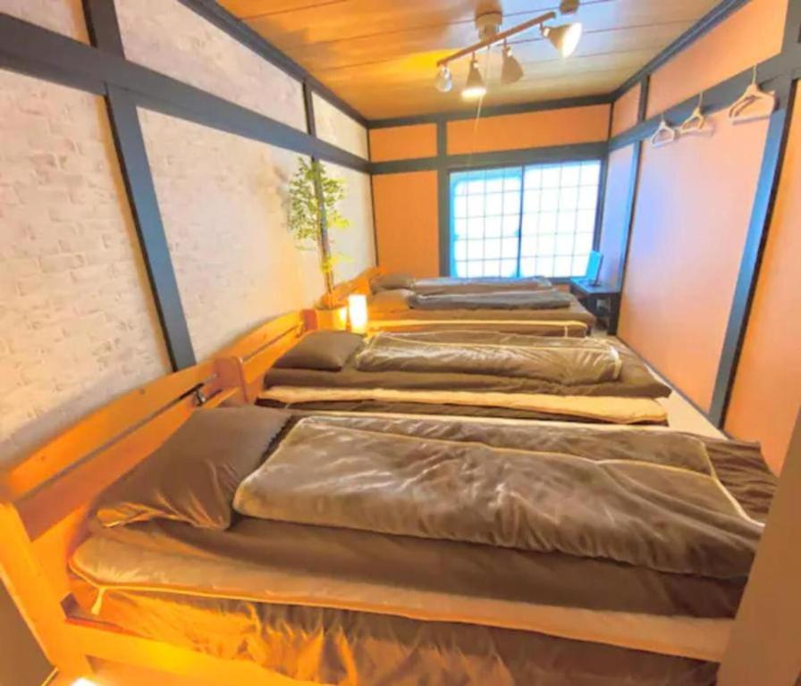 Postel nebo postele na pokoji v ubytování ザホテル湯沢スターダスト