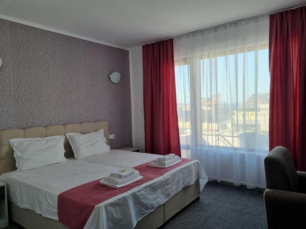 Postel nebo postele na pokoji v ubytování Dani beach Sozopol