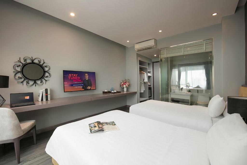 TV a/nebo společenská místnost v ubytování Hanoi Ping Luxury Hotel