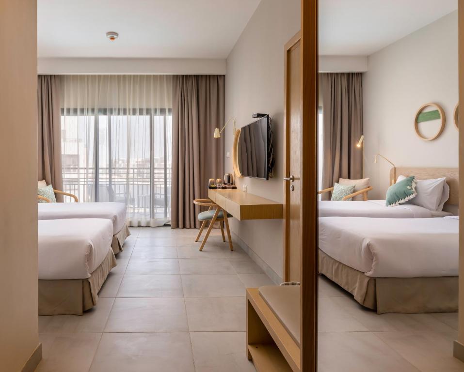 Postel nebo postele na pokoji v ubytování Marassi Boutique Hotel-Marina 1