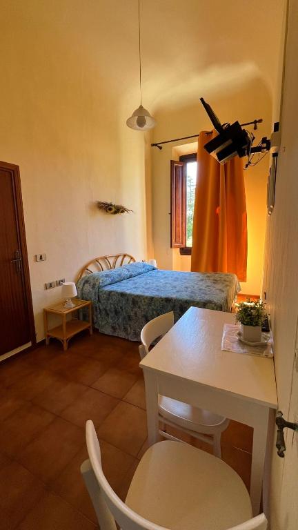 Postel nebo postele na pokoji v ubytování Albergo Pensione Bartoli