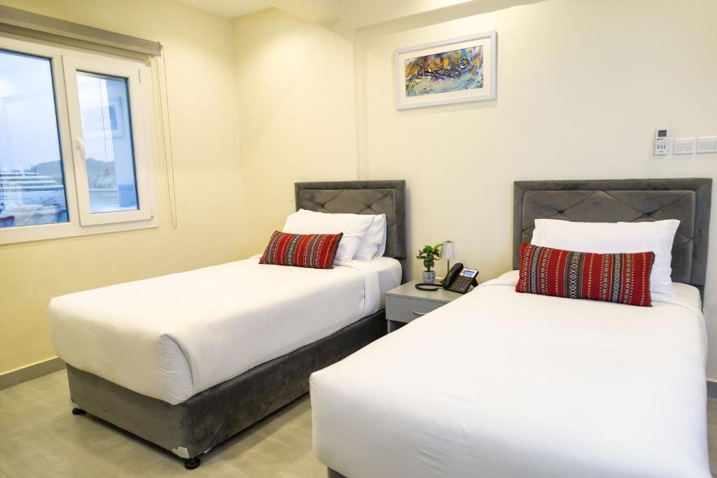 Postel nebo postele na pokoji v ubytování NASEEM HOTEL