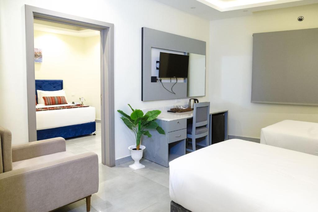 Postel nebo postele na pokoji v ubytování NASEEM HOTEL