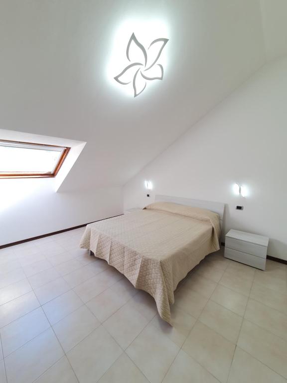 Ένα ή περισσότερα κρεβάτια σε δωμάτιο στο casa vacanze Veronica