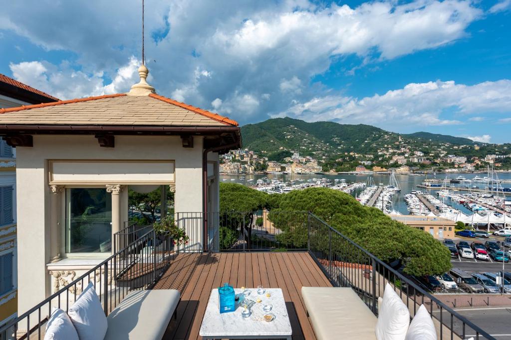 a balcony with a view of a harbor at Villa Porto Rapallo Portofino Coast in Rapallo