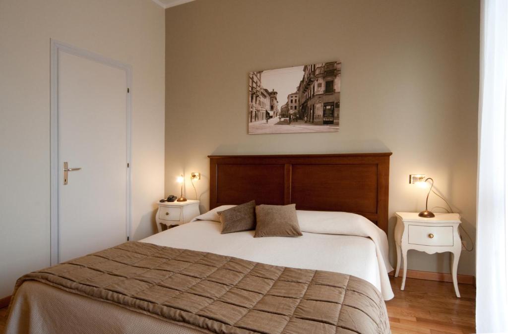 Postel nebo postele na pokoji v ubytování Hotel Belvedere Thiene
