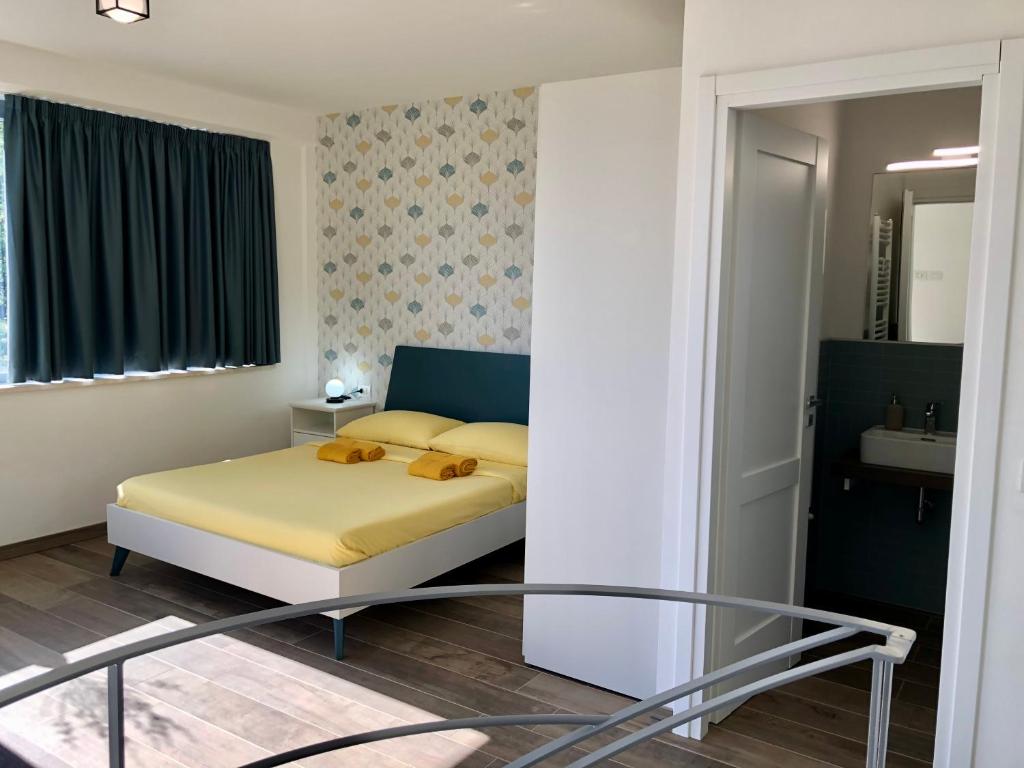Postel nebo postele na pokoji v ubytování Colonna House