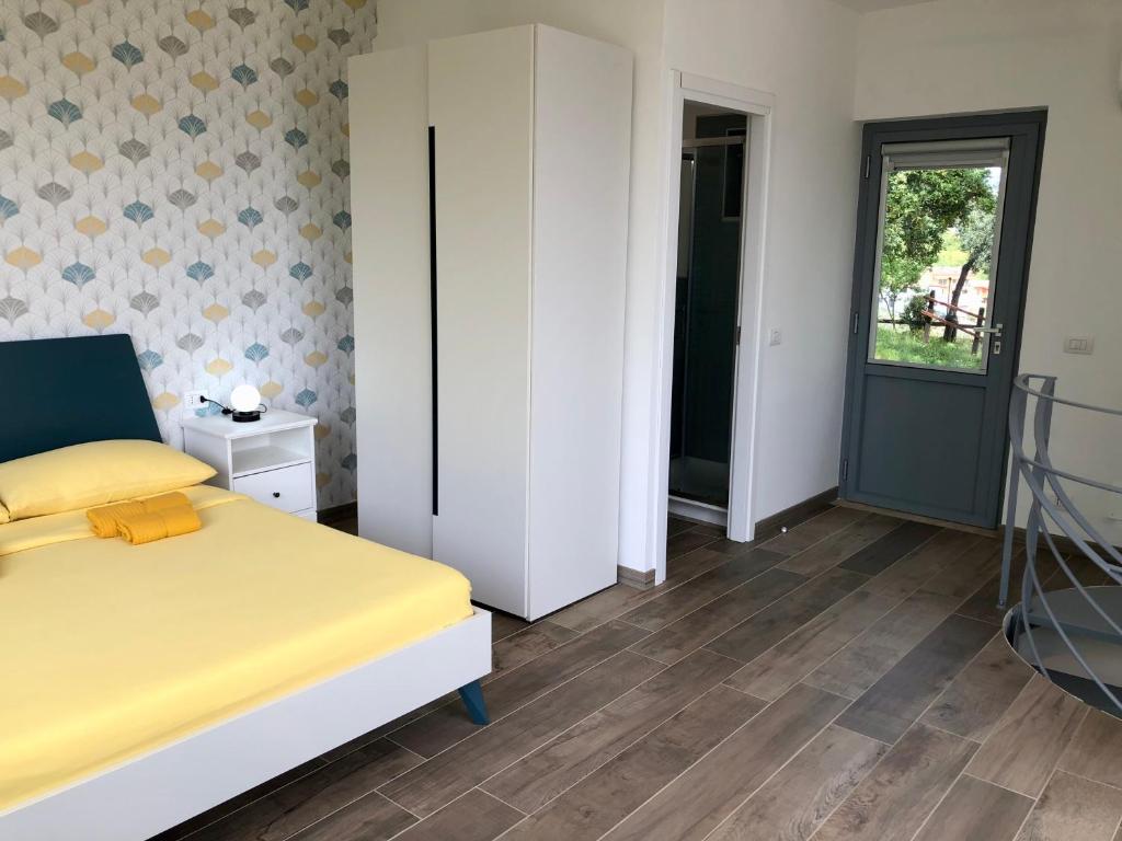 Postel nebo postele na pokoji v ubytování Colonna House