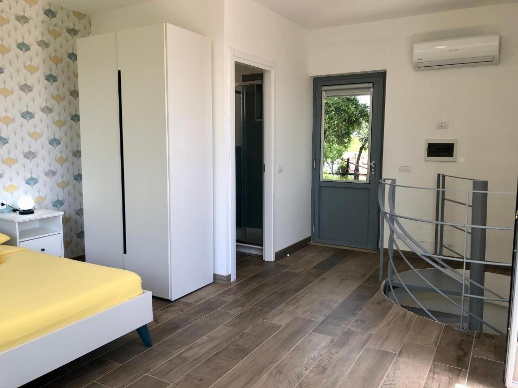 Postel nebo postele na pokoji v ubytování Colonna House