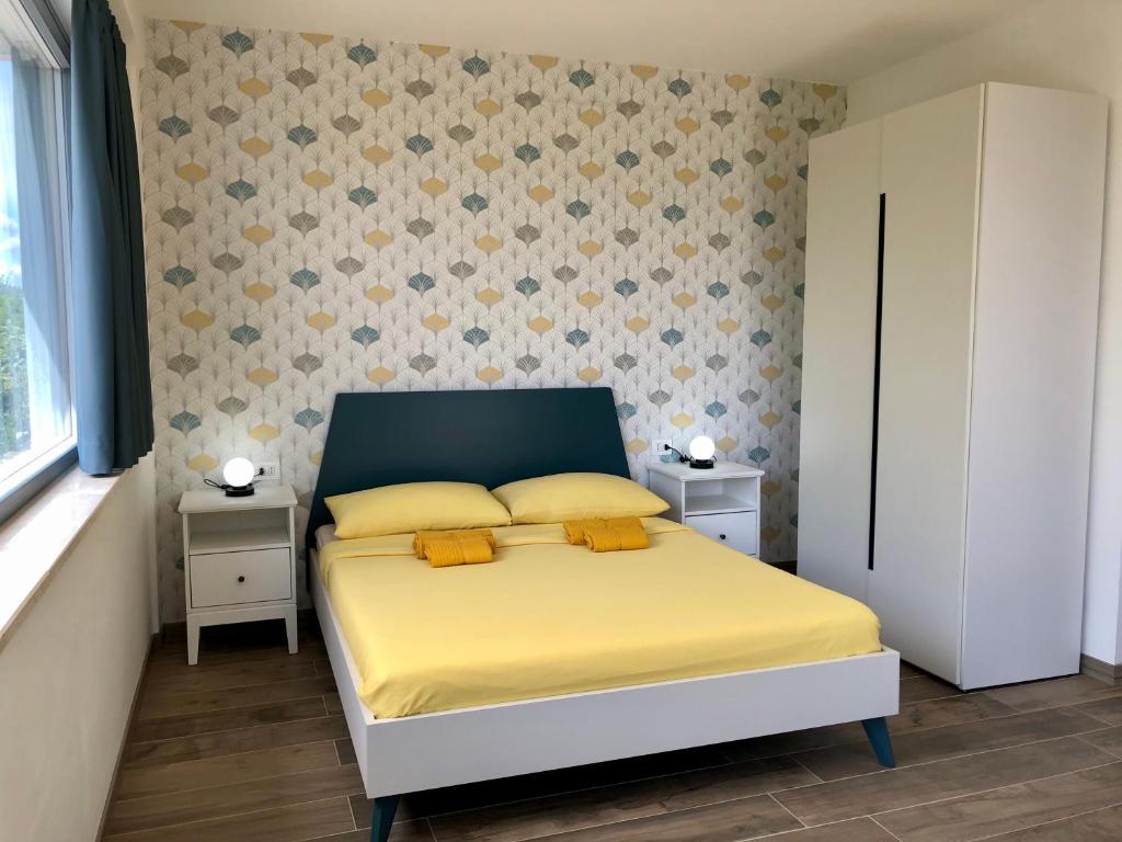 Postel nebo postele na pokoji v ubytování Colonna House