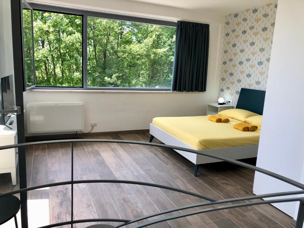Postel nebo postele na pokoji v ubytování Colonna House