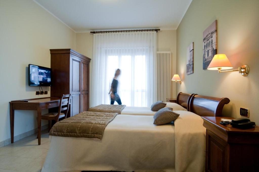 Postel nebo postele na pokoji v ubytování Hotel Belvedere Thiene