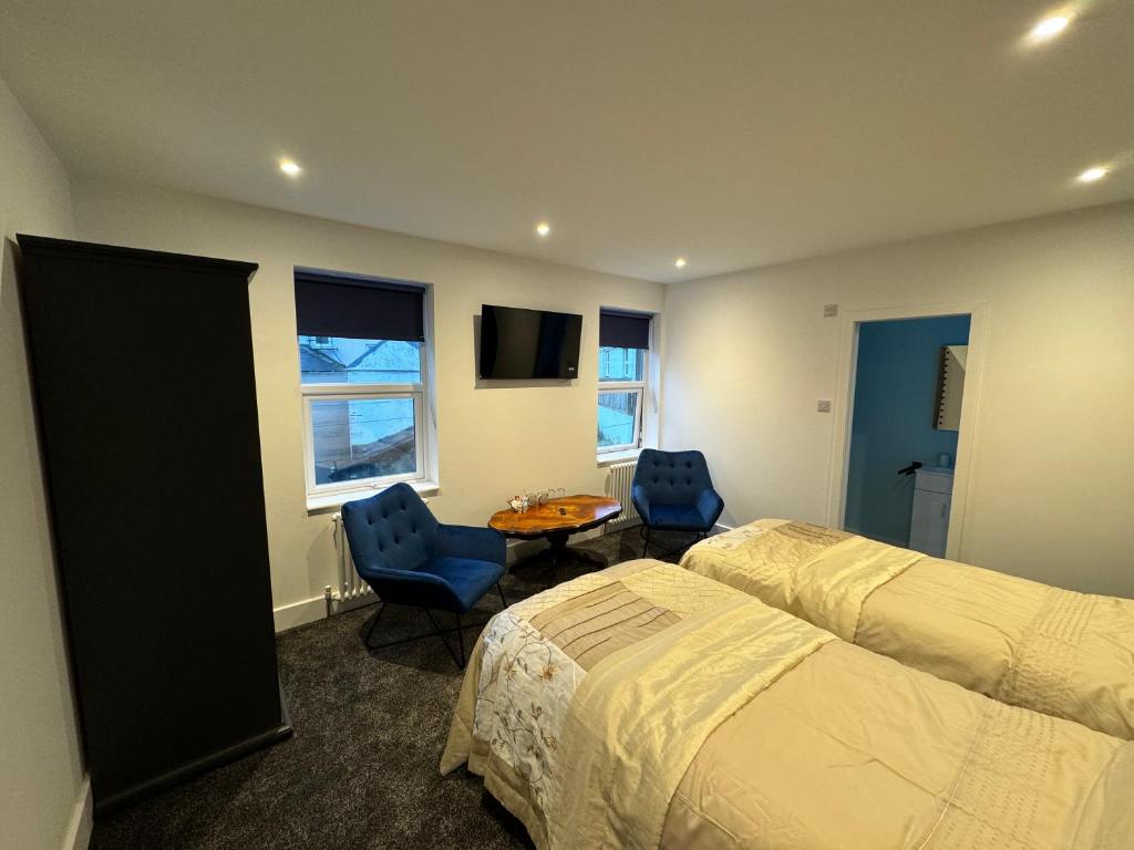 Postel nebo postele na pokoji v ubytování Ashfield Guesthouse