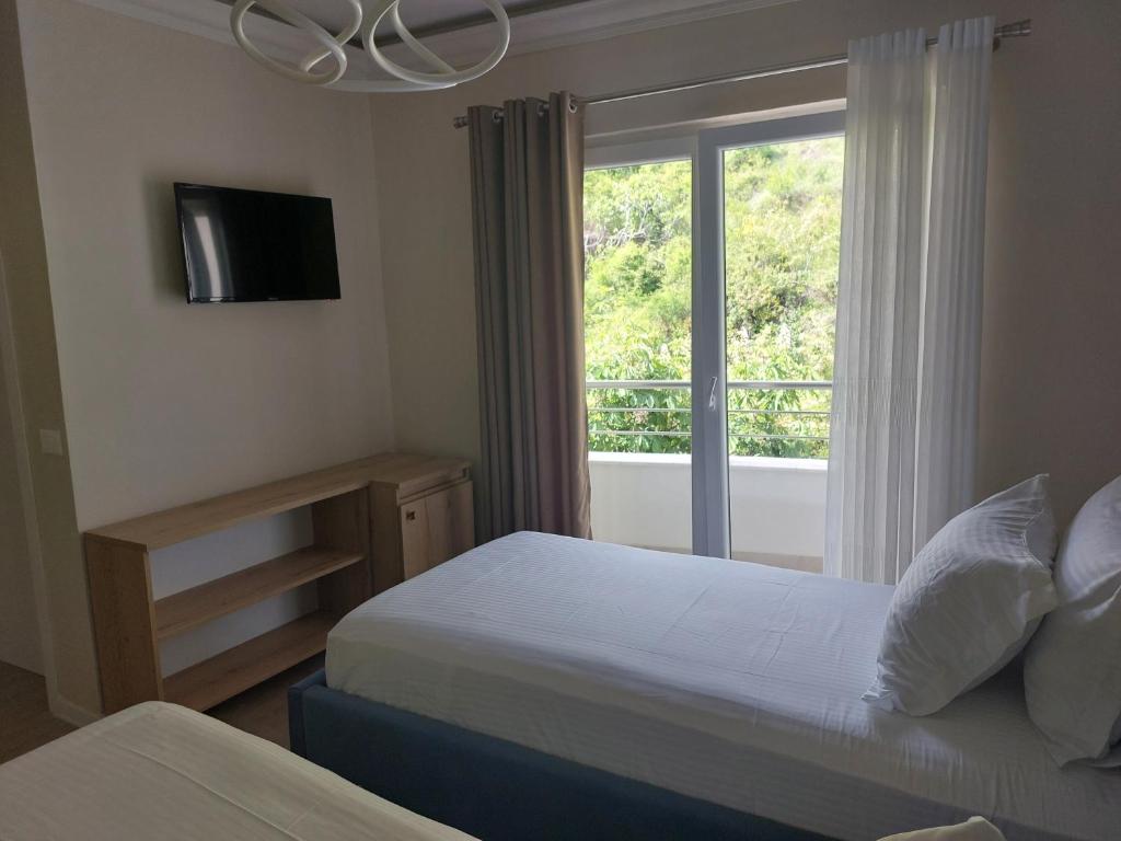 Postel nebo postele na pokoji v ubytování Hotel DEMOLI
