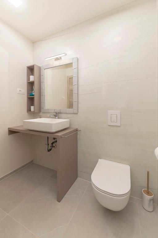 Koupelna v ubytování Rooms S Center
