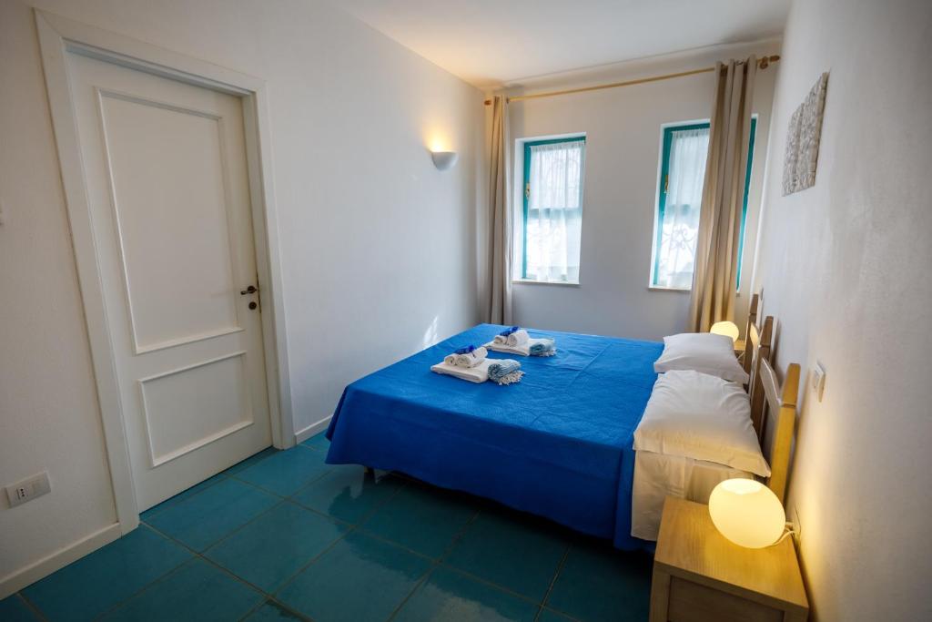 Postel nebo postele na pokoji v ubytování Villa Tre Mari