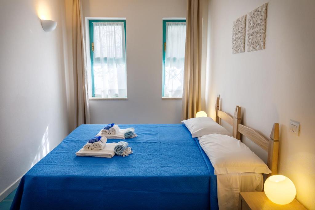 Postel nebo postele na pokoji v ubytování Villa Tre Mari