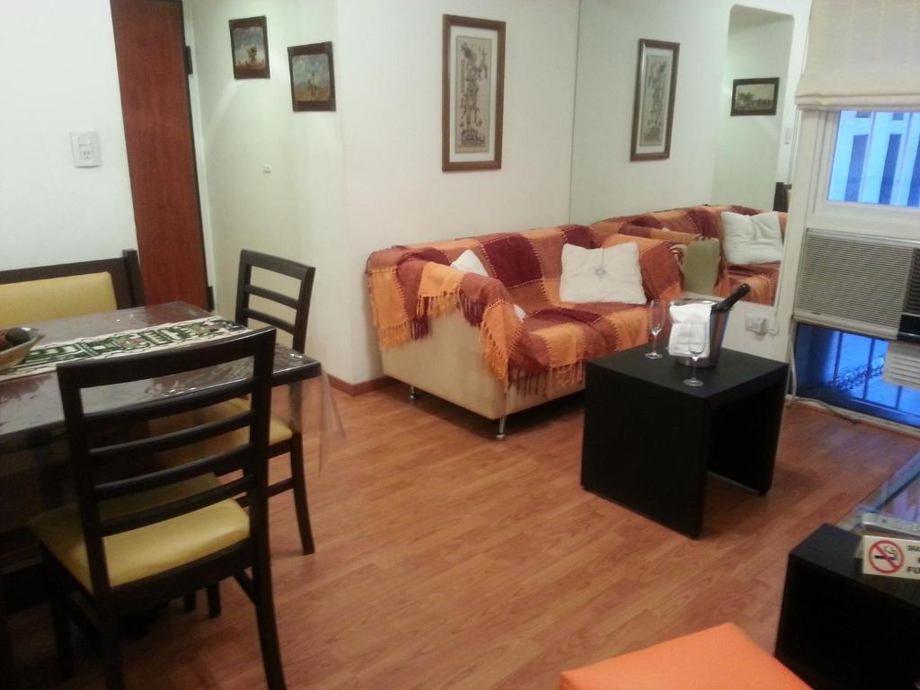 a living room with a couch and a table at Dreams Apartments in Buenos Aires