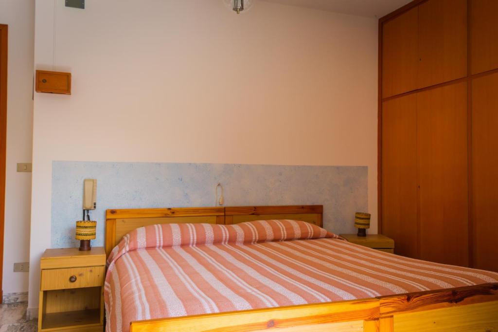 Postel nebo postele na pokoji v ubytování Albergo Speranza