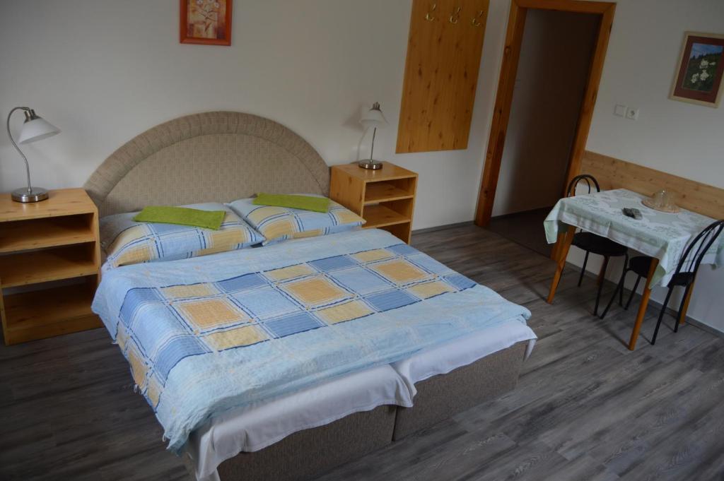 Postel nebo postele na pokoji v ubytování Penzion U pily