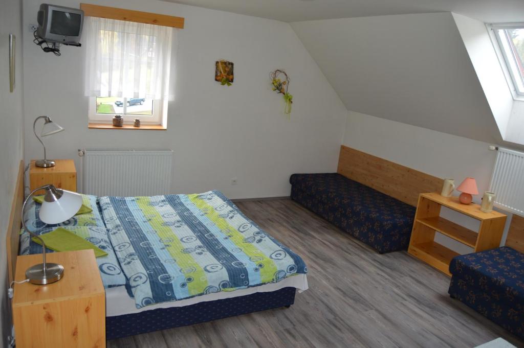 Postel nebo postele na pokoji v ubytování Penzion U pily