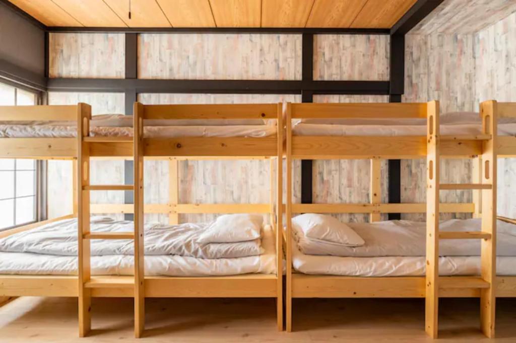 Postel nebo postele na pokoji v ubytování ザホテル湯沢スターダスト