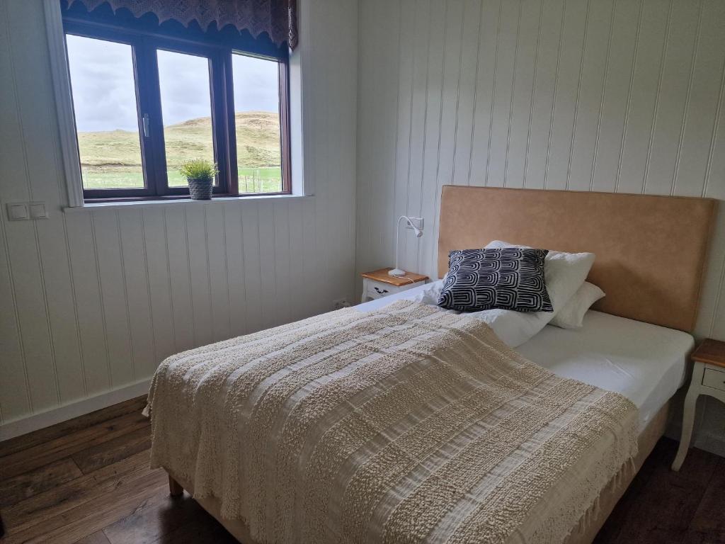 Letto o letti in una camera di Sólheimahjáleiga Guesthouse