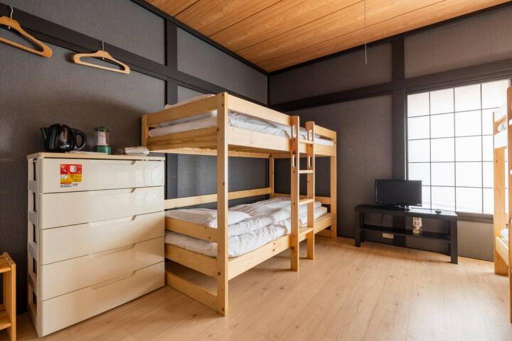 Postel nebo postele na pokoji v ubytování ザホテル湯沢スターダスト