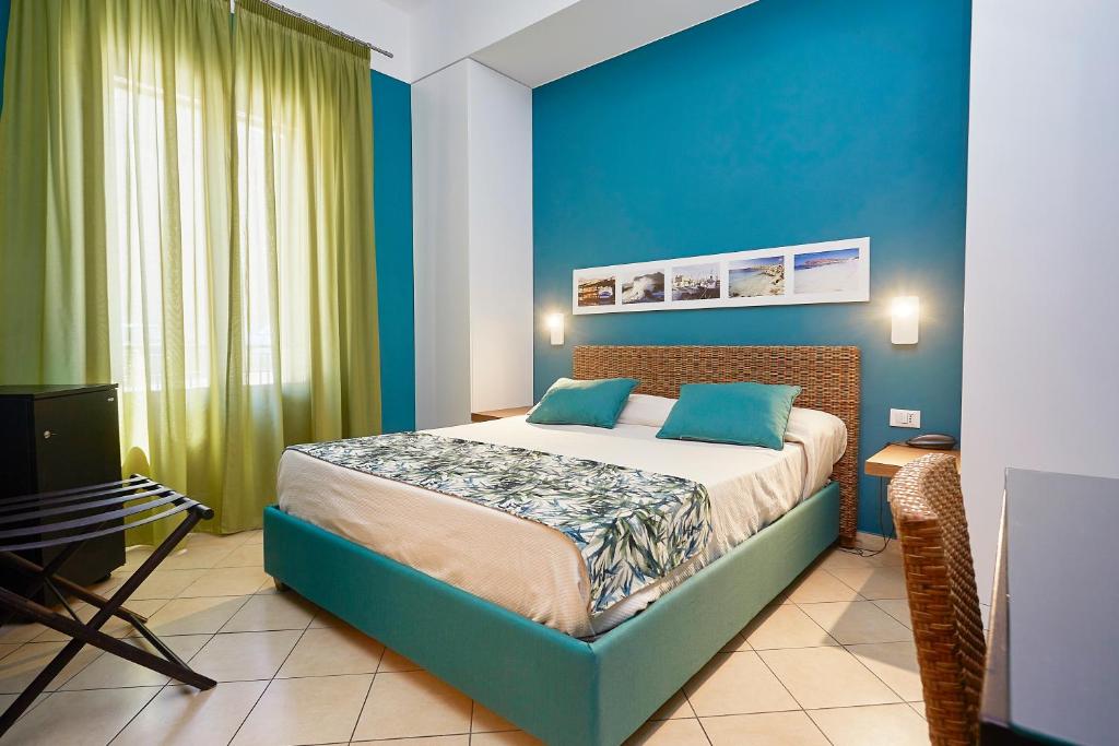 Posteľ alebo postele v izbe v ubytovaní Insula Hotel