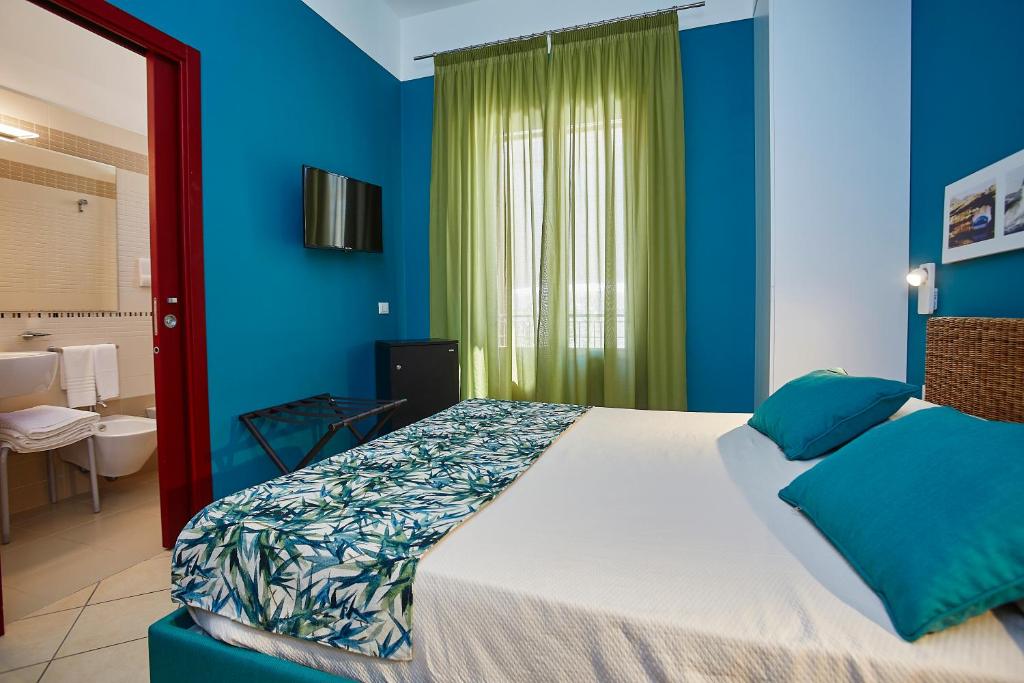 Posteľ alebo postele v izbe v ubytovaní Insula Hotel