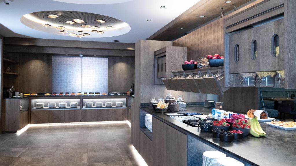 Kuchyň nebo kuchyňský kout v ubytování Hotel Alpina