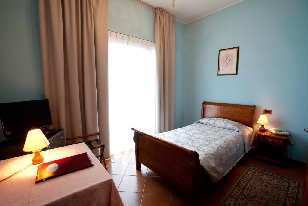 Postel nebo postele na pokoji v ubytování Hotel Nastro Azzurro