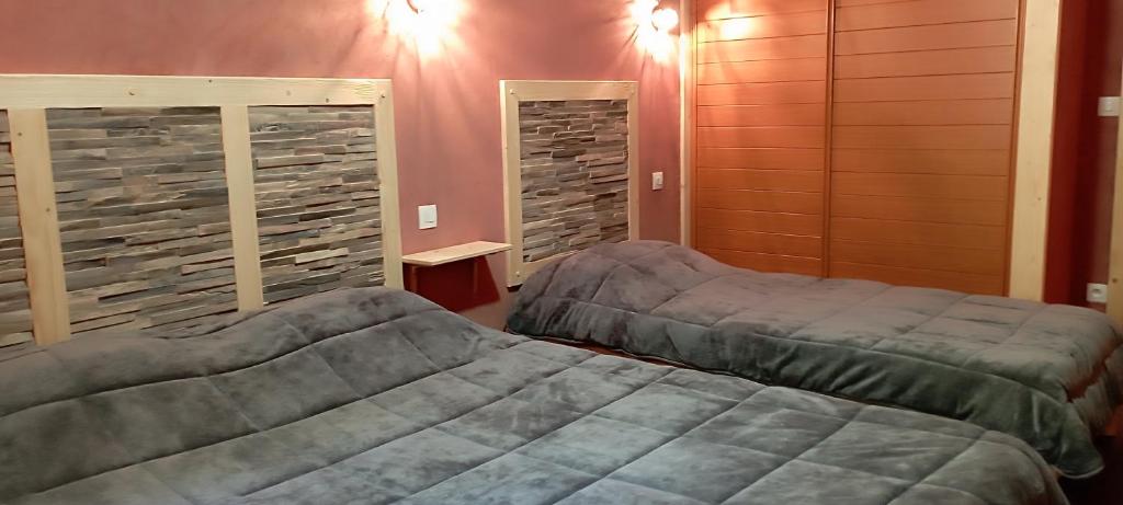 Ein Bett oder Betten in einem Zimmer der Unterkunft Chalet les Alpes - Le Sapey