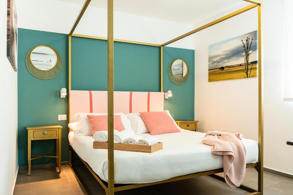 Postel nebo postele na pokoji v ubytování Verdeaqua Rooms