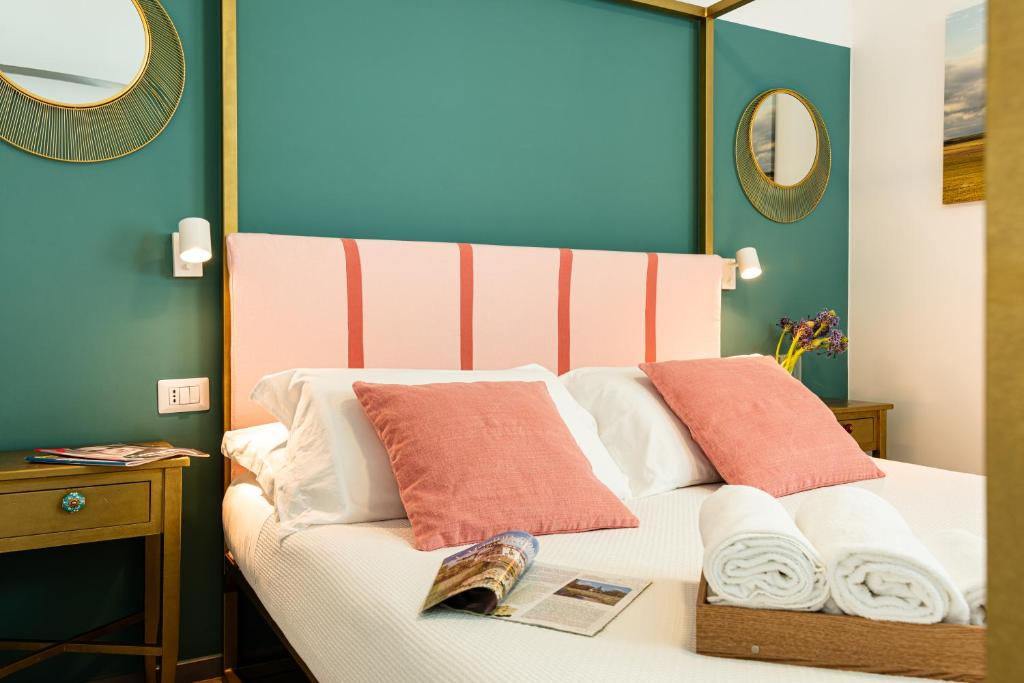 Postel nebo postele na pokoji v ubytování Verdeaqua Rooms