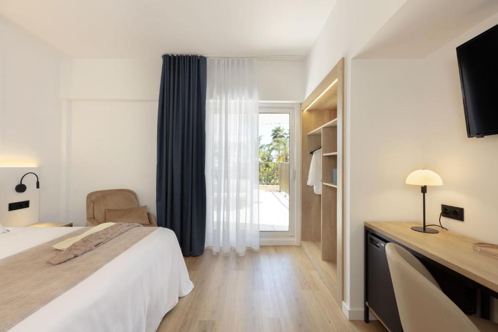 Posteľ alebo postele v izbe v ubytovaní Hotel Rovira