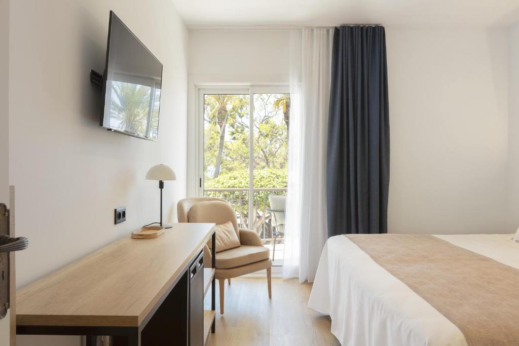 Posteľ alebo postele v izbe v ubytovaní Hotel Rovira