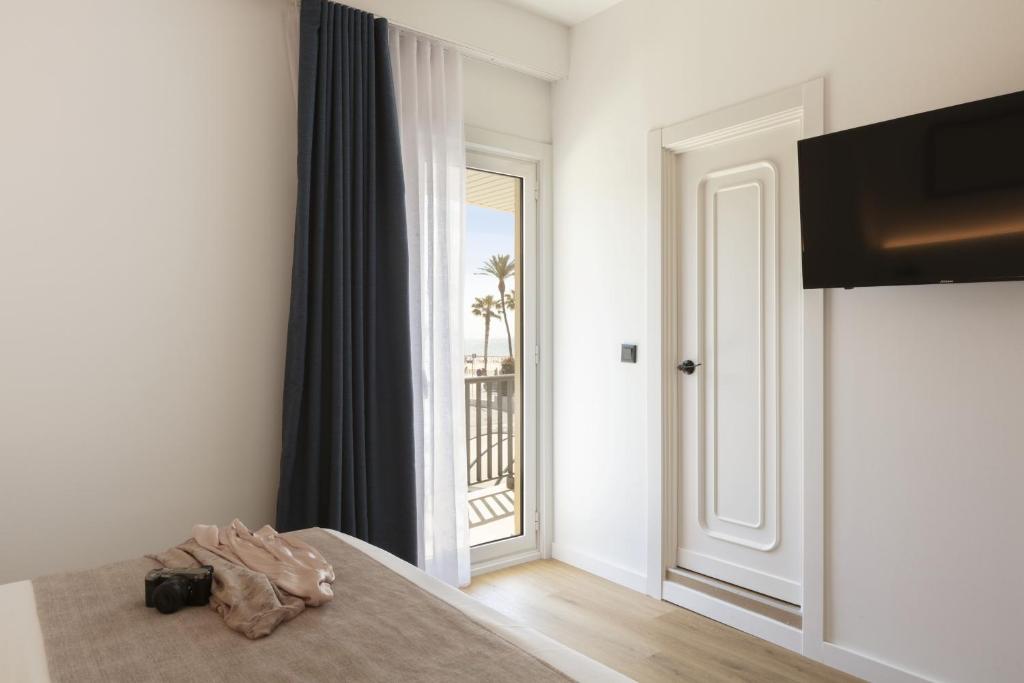 Posteľ alebo postele v izbe v ubytovaní Hotel Rovira