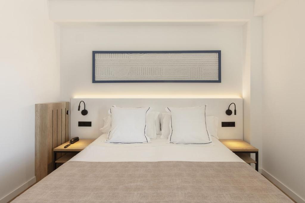 Posteľ alebo postele v izbe v ubytovaní Hotel Rovira