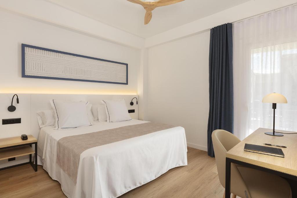 Posteľ alebo postele v izbe v ubytovaní Hotel Rovira