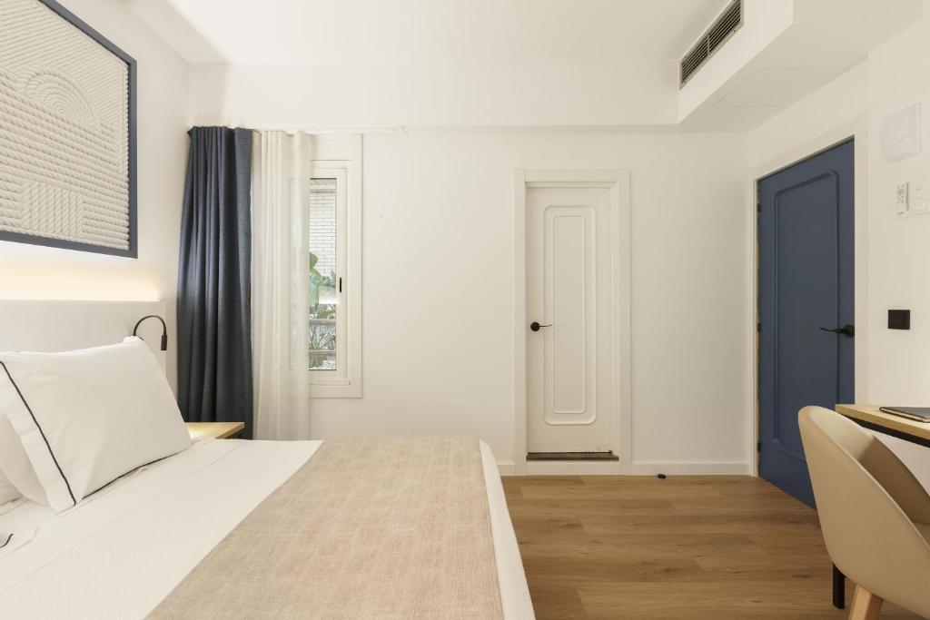 Posteľ alebo postele v izbe v ubytovaní Hotel Rovira