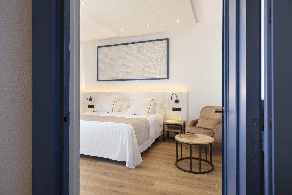 Posteľ alebo postele v izbe v ubytovaní Hotel Rovira