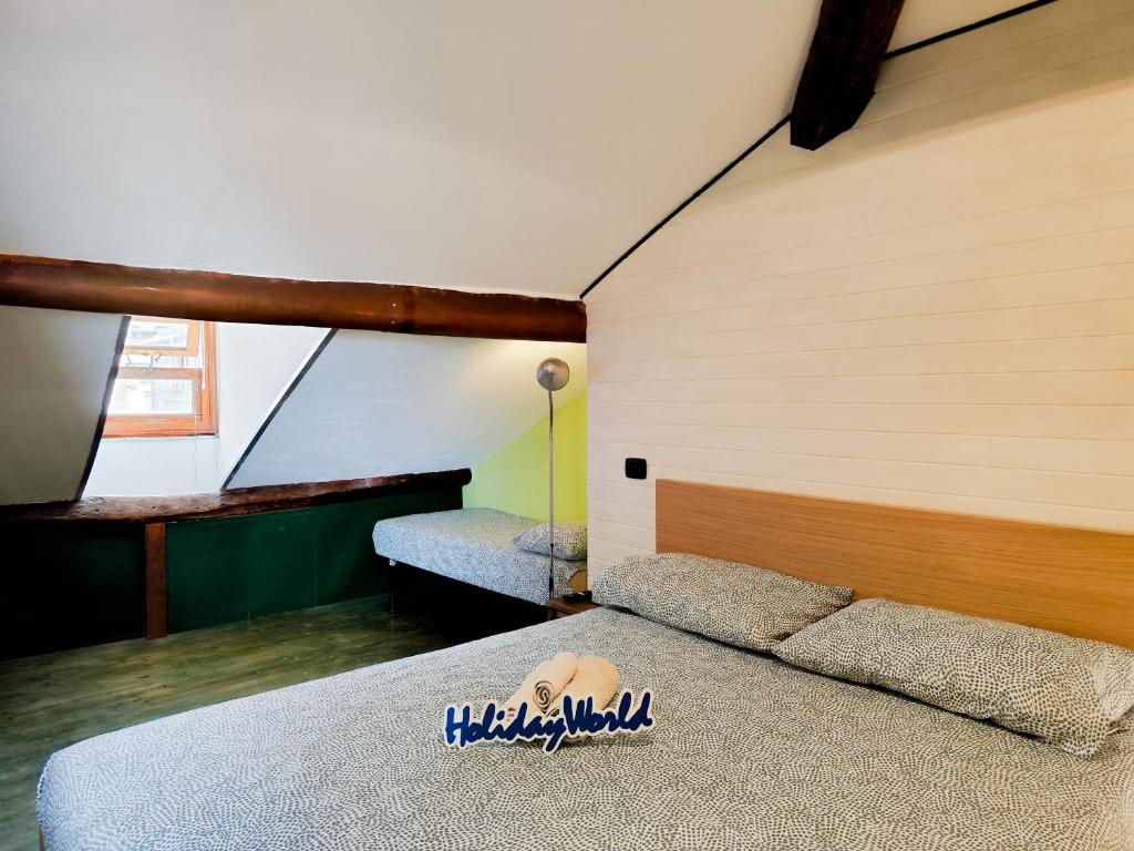 Cama o camas de una habitación en Fuori Rotta House by Holiday World